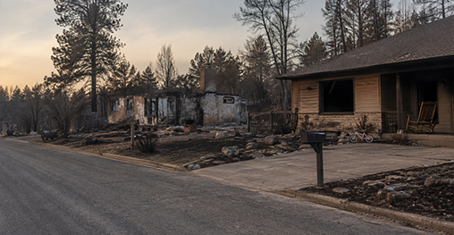 Residents among the remains of a burned Spokane home